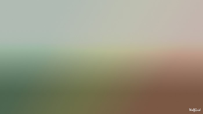 Blurred gradient of green, grey, and brown