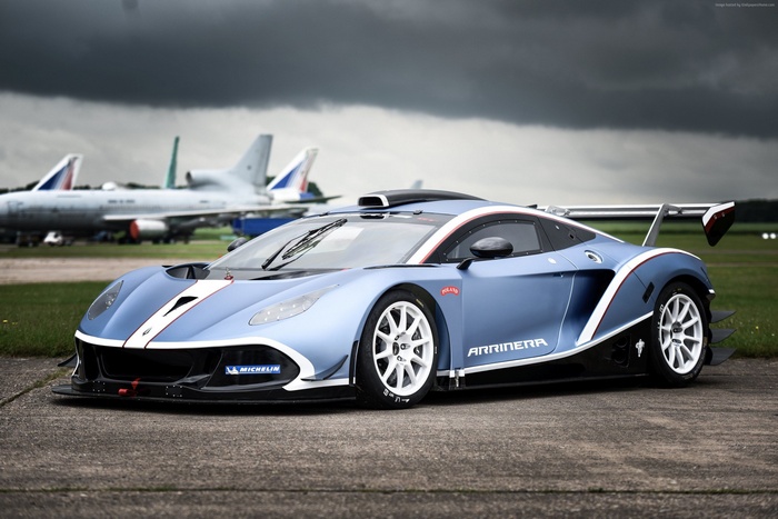 Arrinera Hussarya GT supercar on tarmac with airplanes
