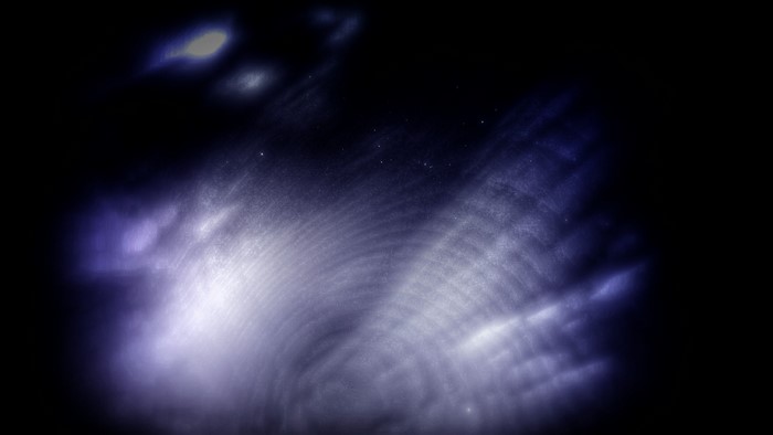 Abstract blue and white light patterns in darkness