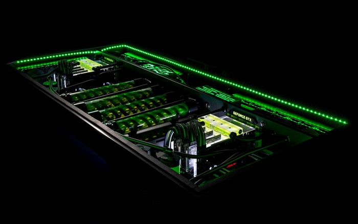 Custom PC build with green lighting and water cooling