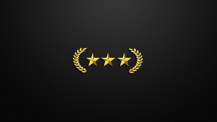 Three golden stars with laurel wreaths