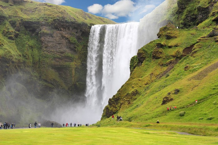 Skogafoss Waterfall in Iceland with Tourists
