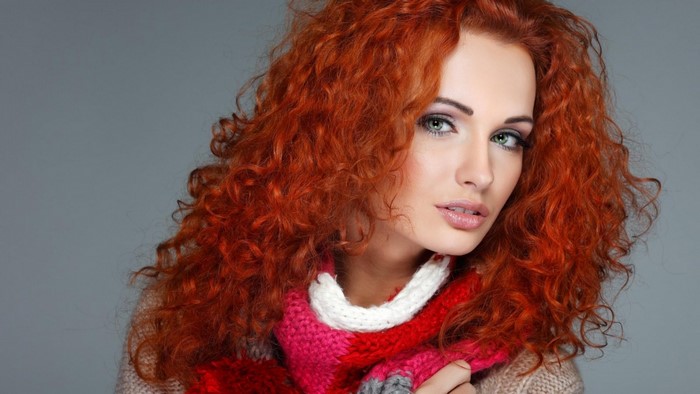 Redhead Woman with Curly Hair and Colorful Scarf