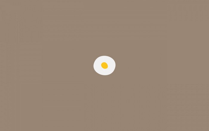 Minimalist fried egg on brown background