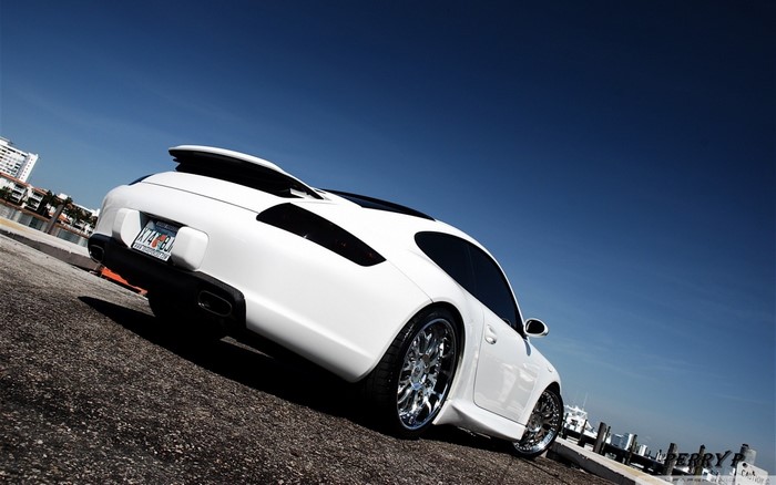 White Porsche Sports Car with Chrome Wheels
