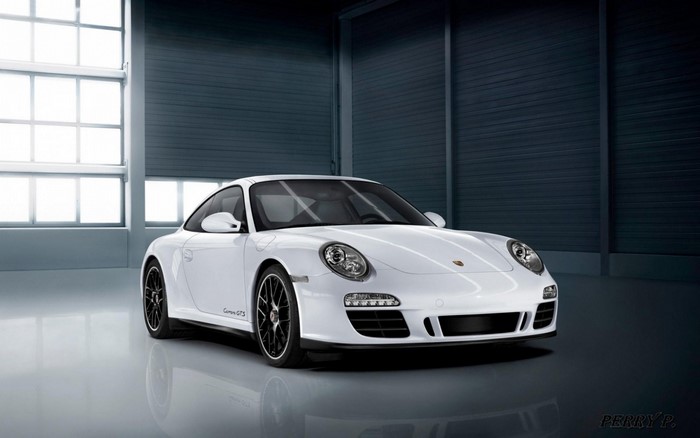 White Porsche Carrera GTS in a garage