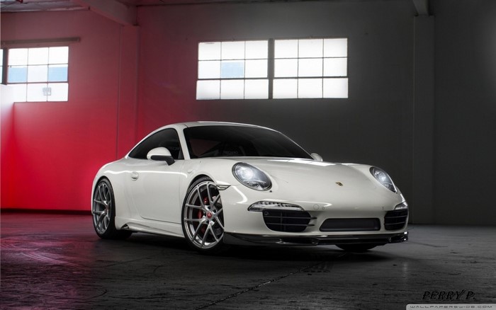 White Porsche 911 sports car in a studio