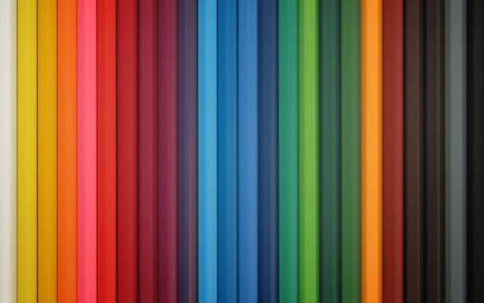 Abstract pattern of colorful pencils in a rainbow spectrum