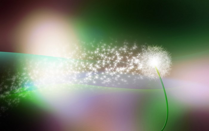 Dandelion with glowing seeds and abstract background