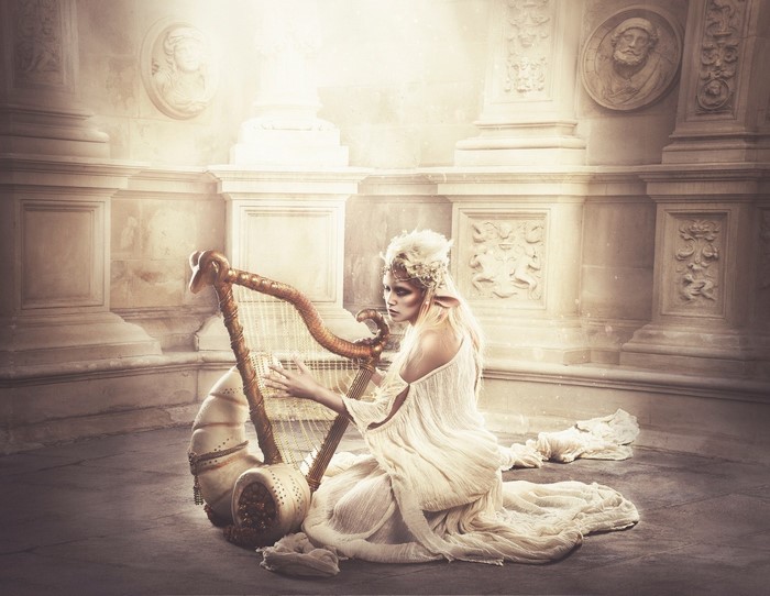 Woman playing a harp in a classical temple
