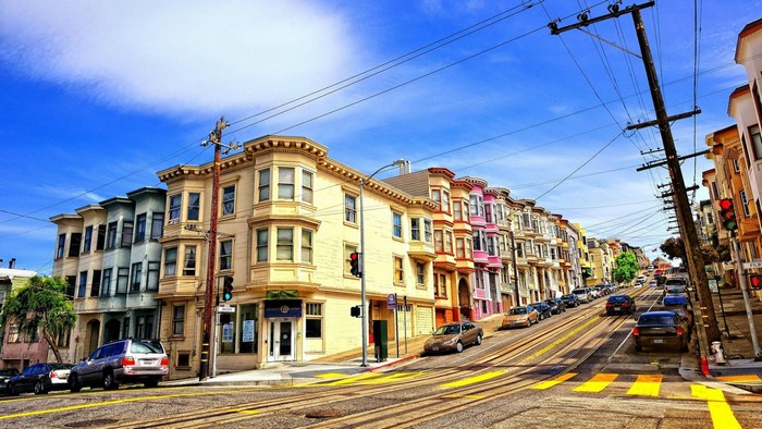 San Francisco street with colorful houses and cable car tracks