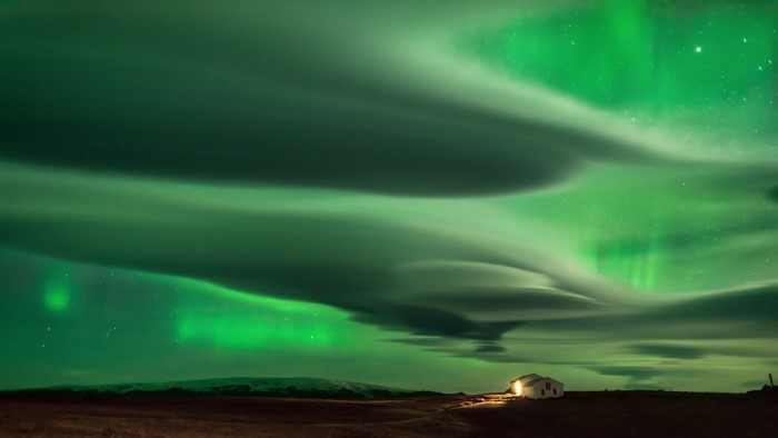 Aurora Borealis over a house in Iceland
