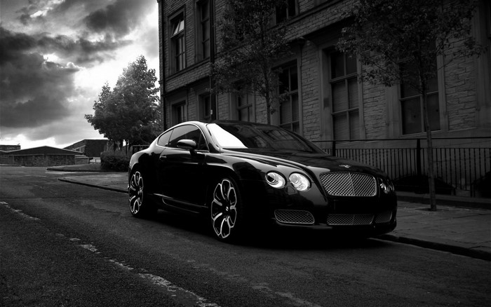 Black Bentley Continental GT parked on street