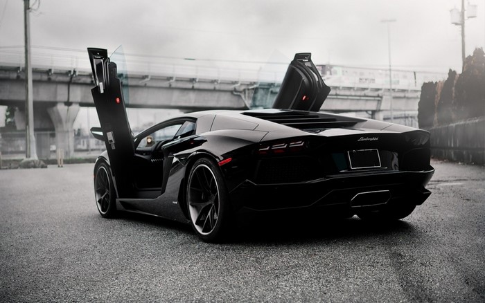 Black Lamborghini Aventador with scissor doors open