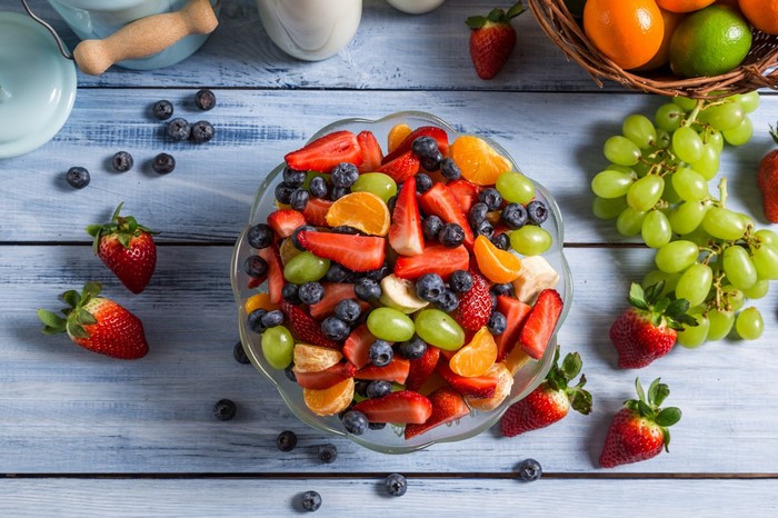Fruit salad with strawberries, blueberries, grapes, and oranges