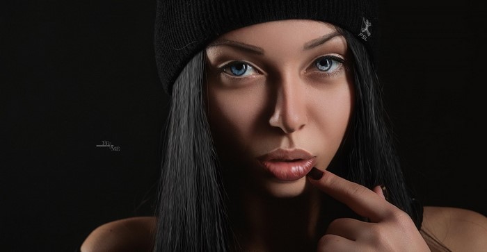 Close-up Portrait of Woman with Blue Eyes and Black Beanie