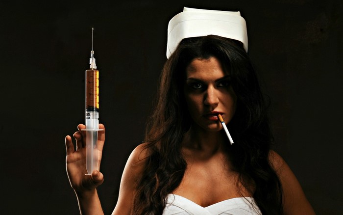 Woman in nurse hat holding syringe and cigarette