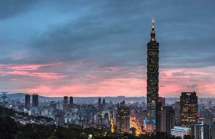 Taipei 101 skyscraper at dusk with city skyline
