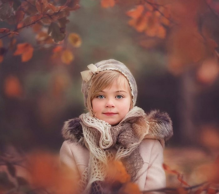 Young girl in autumn hat and scarf