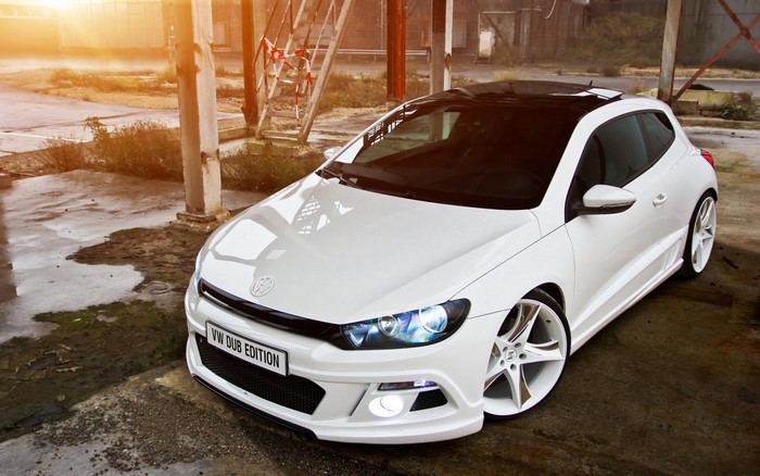 White Volkswagen Scirocco with custom wheels
