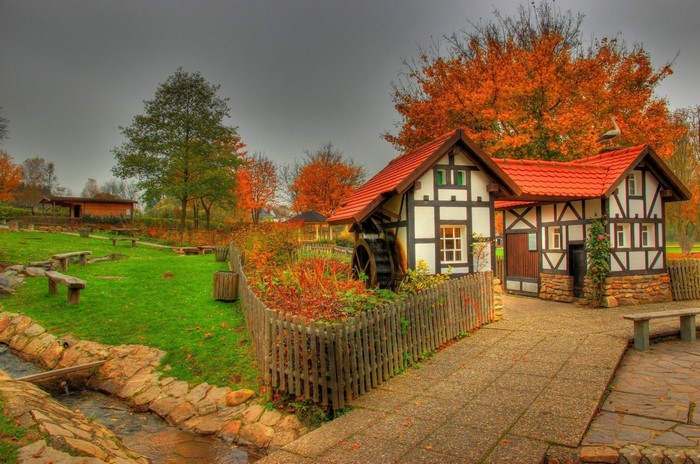 Autumn scene with a half-timbered watermill house