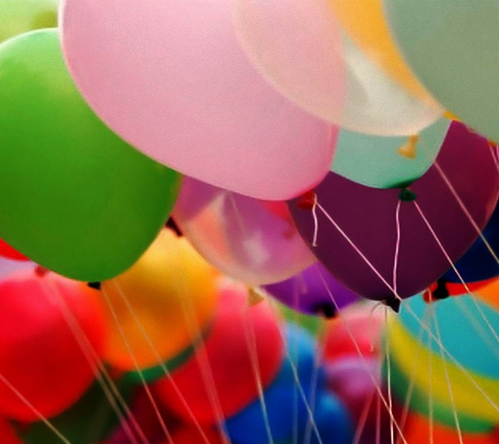 A close-up of many colorful balloons