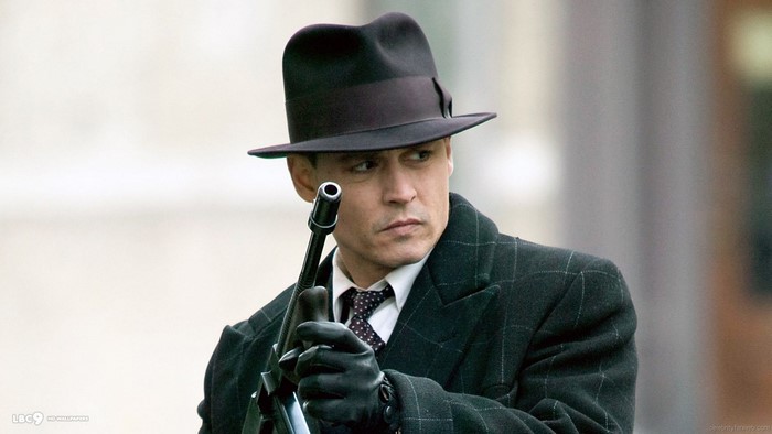 John Dillinger from Public Enemies holding a gun
