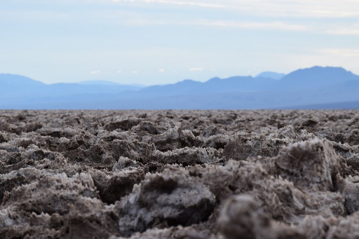 Salt flats with mountains in the background