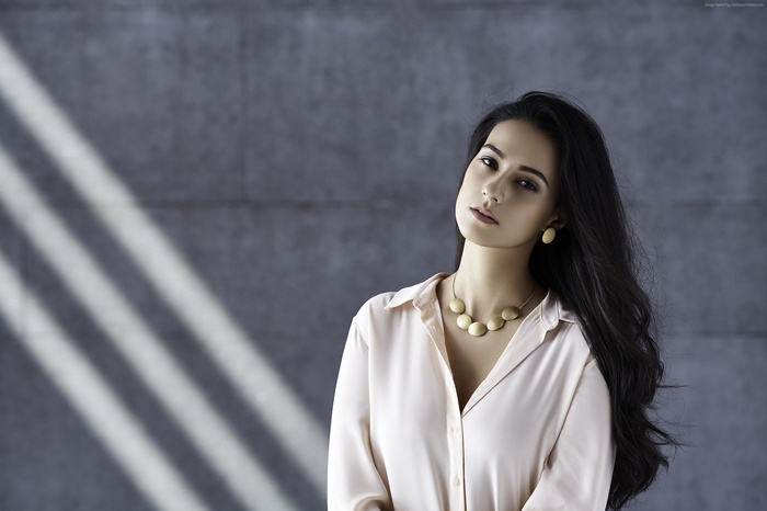 Amy Jackson wearing a light pink shirt and necklace
