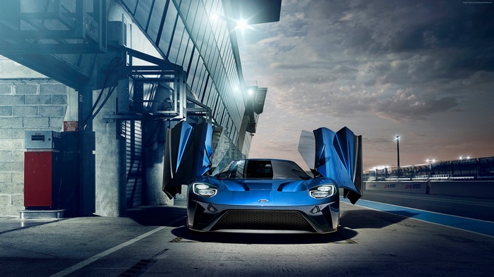 Blue Ford GT race car with doors open at Le Mans