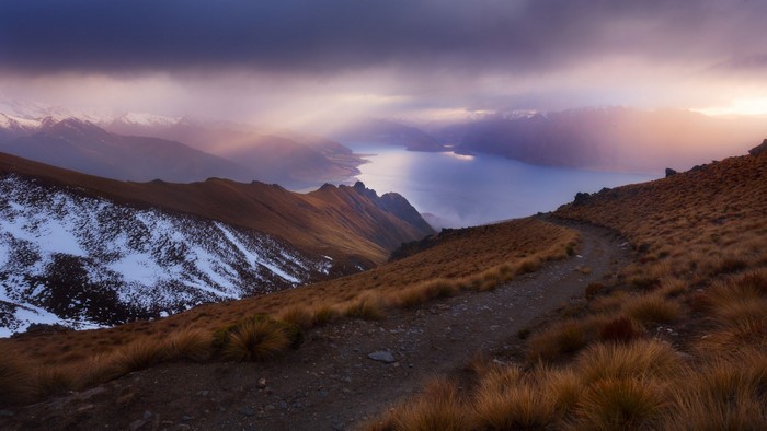Sunset Over Snowy Mountain Lake and Ridge