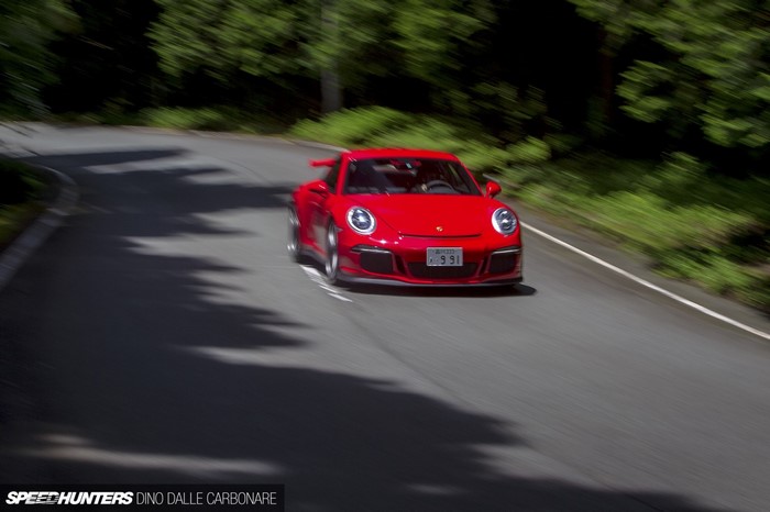 Red Porsche 911 GT3 on a Winding Road