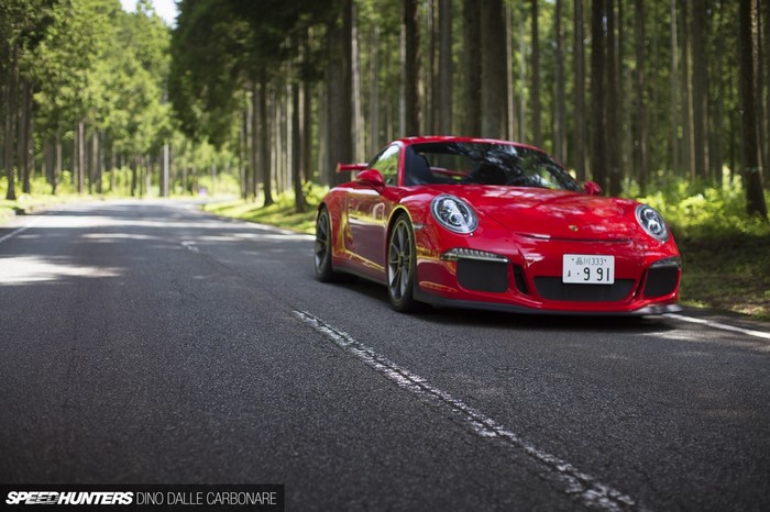 Red Porsche 911 GT3 on a Forest Road