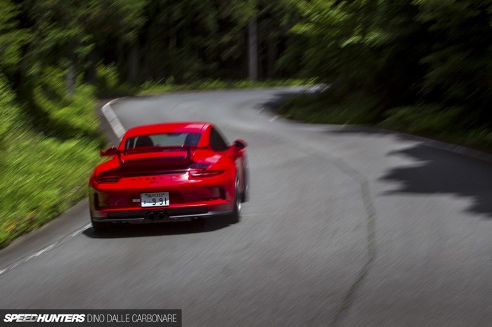 Red Porsche 911 GT3 on a Winding Road