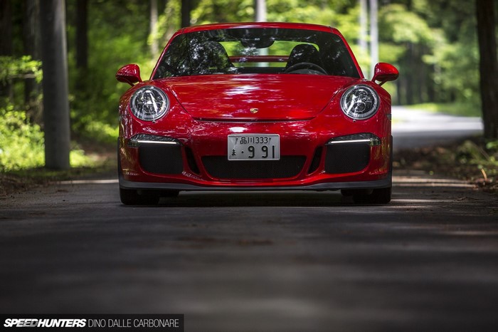 Red Porsche 911 GT3 on a Forest Road