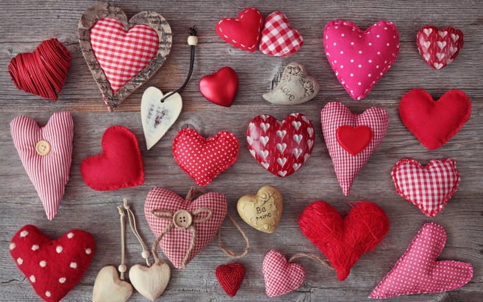 Assortment of Valentine's Day Heart Decorations on Wood