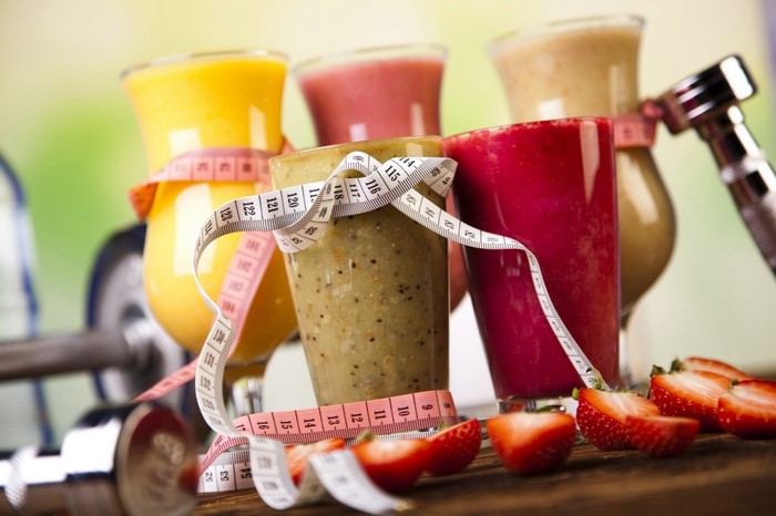Healthy Smoothies with Dumbbells and Strawberries