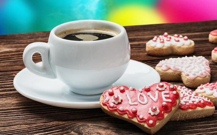 Cup of coffee with heart-shaped cookies