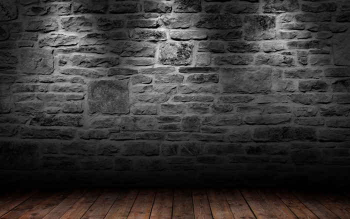 Stone wall with wooden floor and spotlight