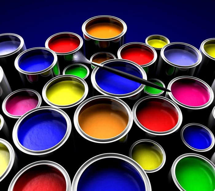 Colorful paint cans and a paintbrush