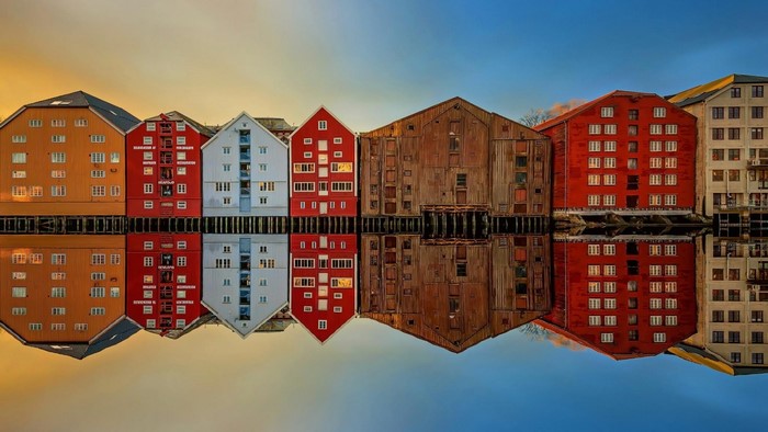 Colorful buildings reflected in water in Trondheim