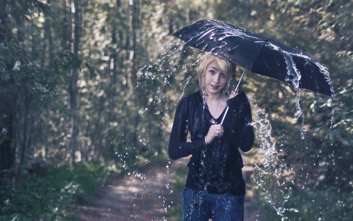 Woman holding an umbrella in the rain