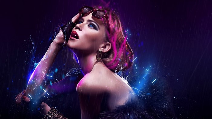 Woman with pink hair and sunglasses in the rain