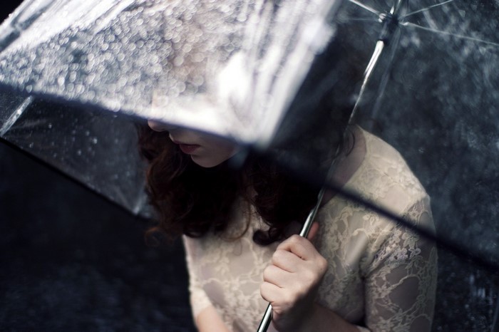 Woman holding an umbrella in the rain