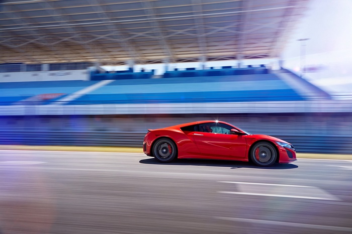 Red Honda NSX supercar on a race track
