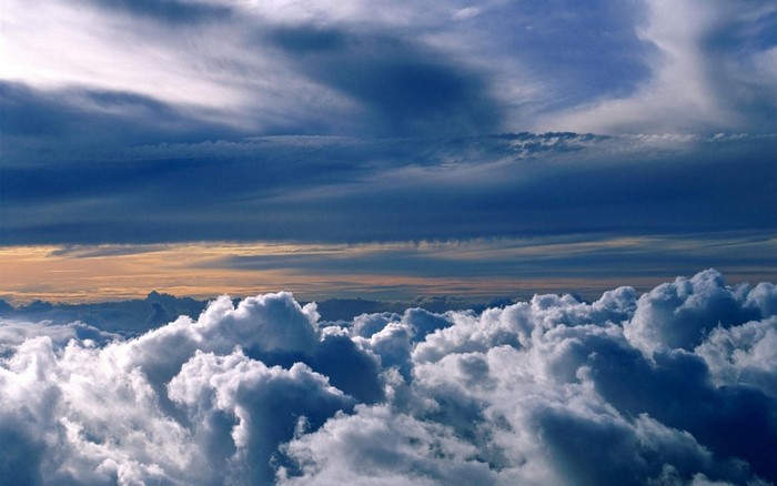 Above the clouds at sunset