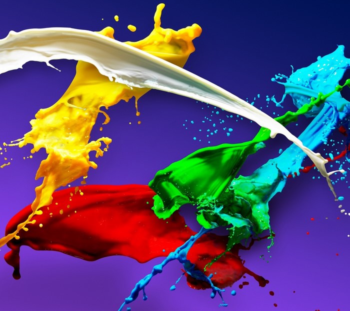Colorful paint splashes on a purple background