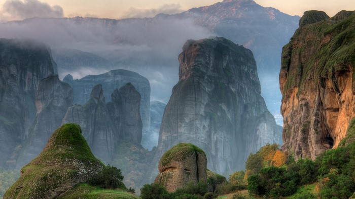 Misty mountains and rock formations in Meteora, Greece