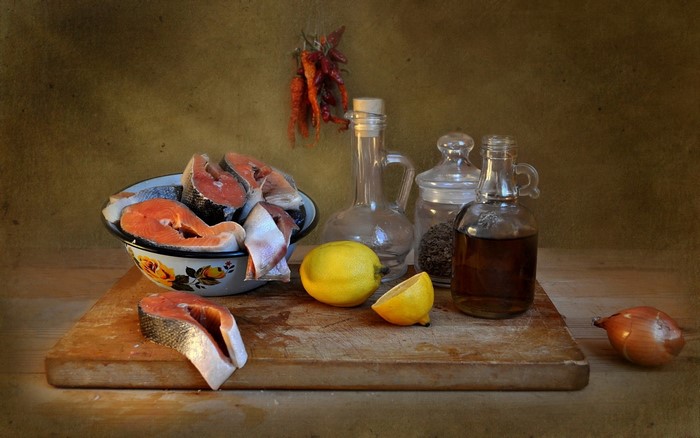 Still life painting of salmon, lemon, and spices
