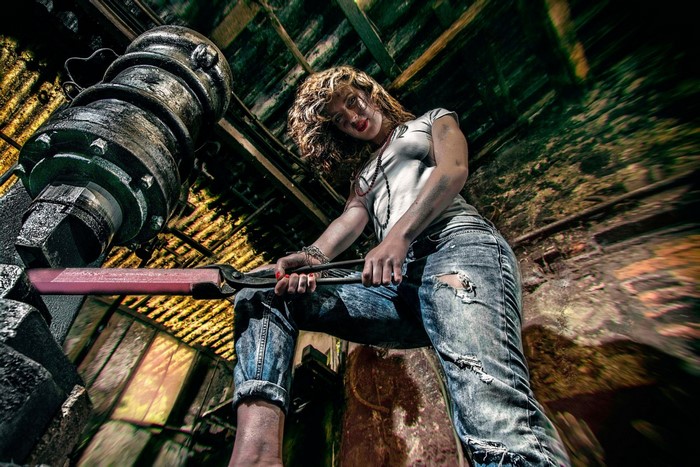 Woman working with a large industrial machine